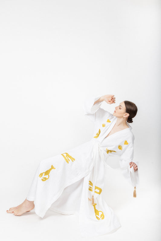 White embroidered gold wrap gown