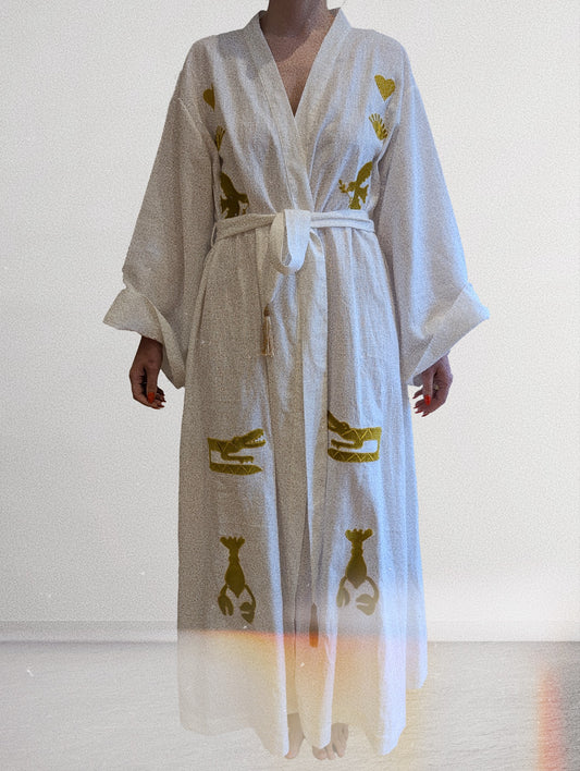 White embroidered gold wrap gown