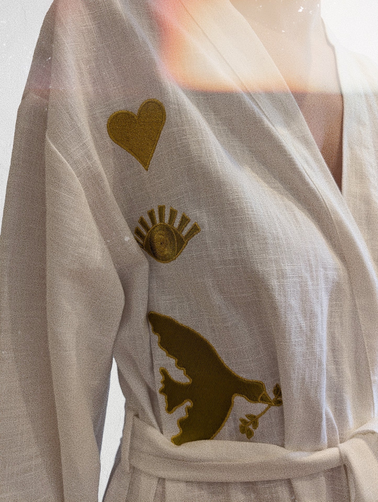 White embroidered gold wrap gown