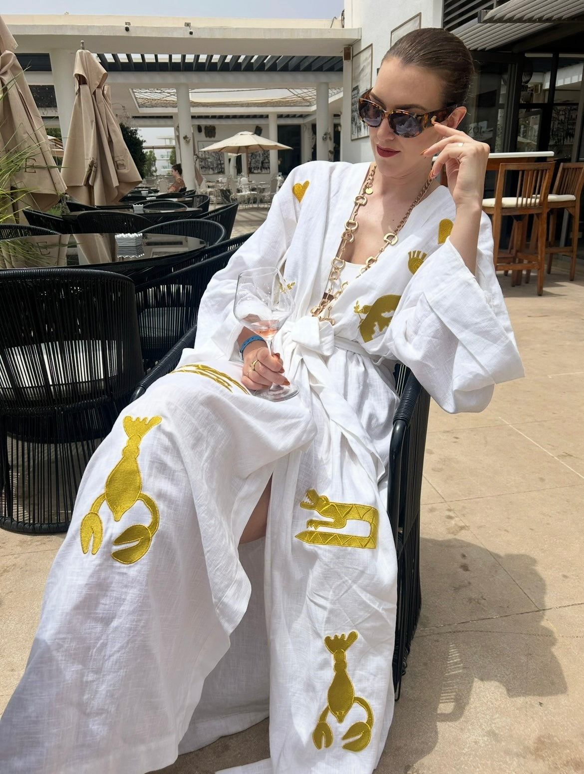 White embroidered gold wrap gown