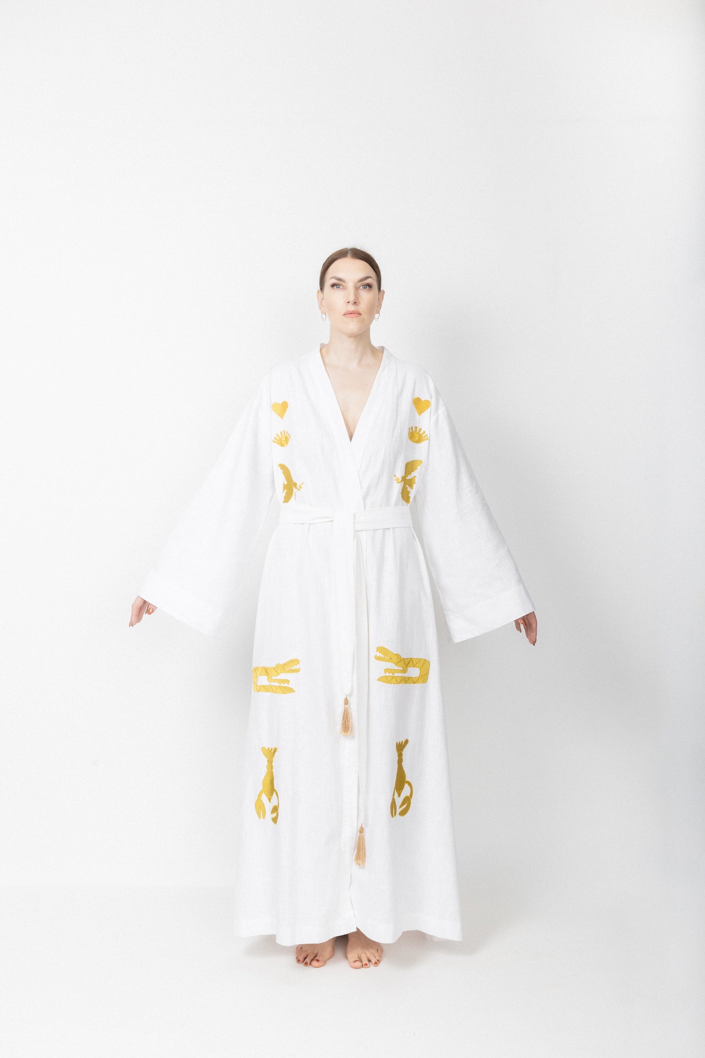 White embroidered gold wrap gown