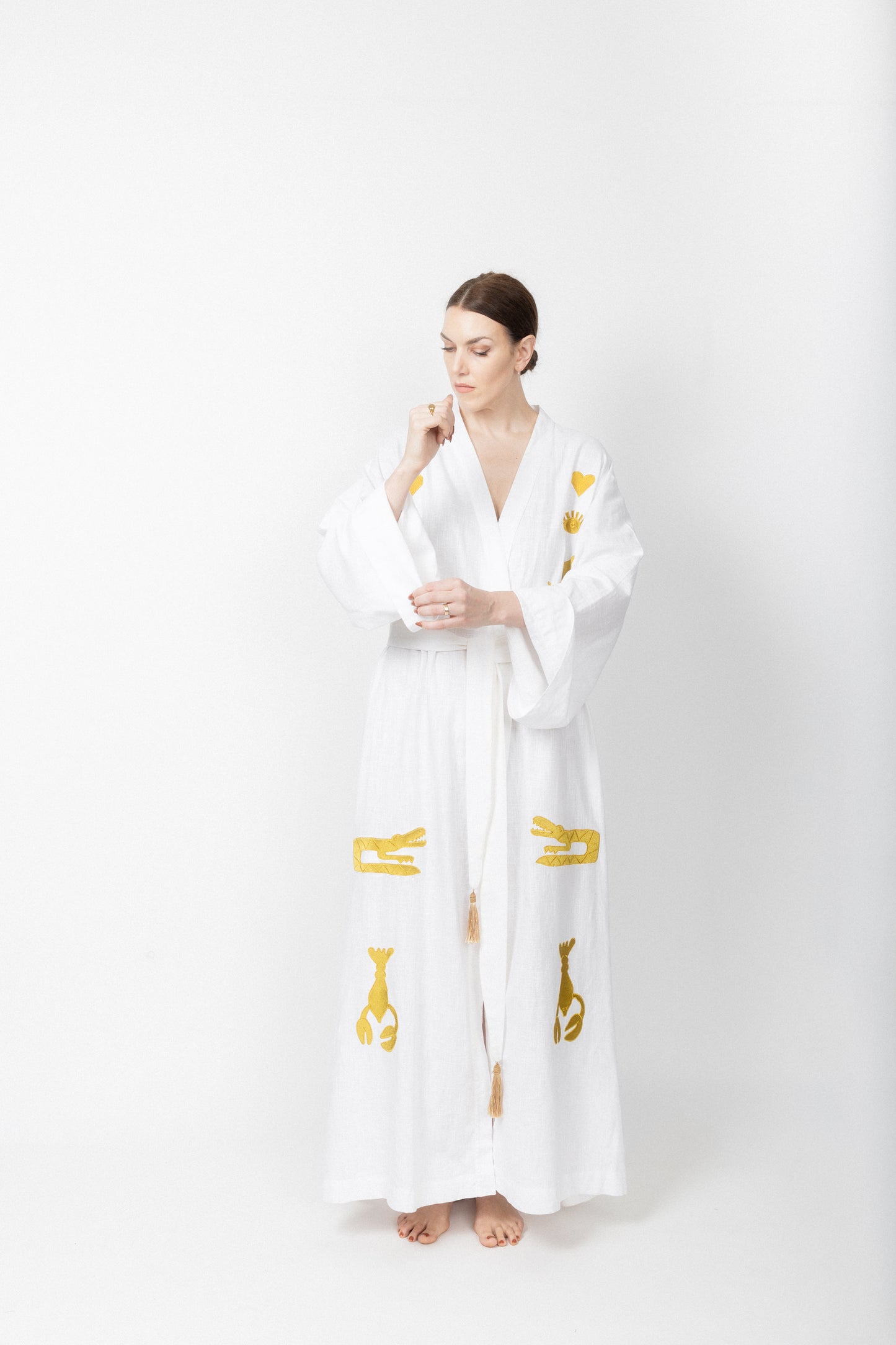 White embroidered gold wrap gown