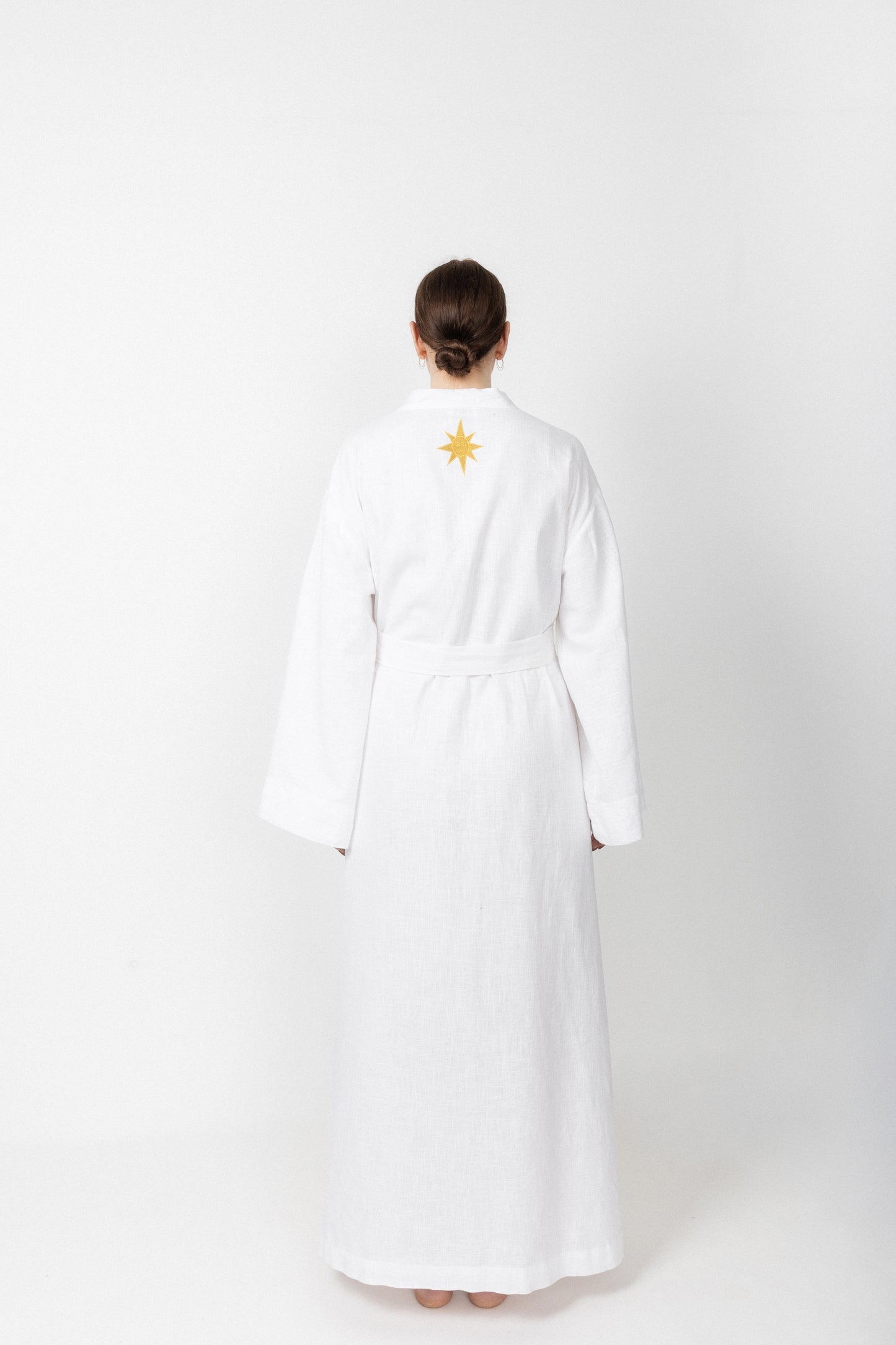 White embroidered gold wrap gown