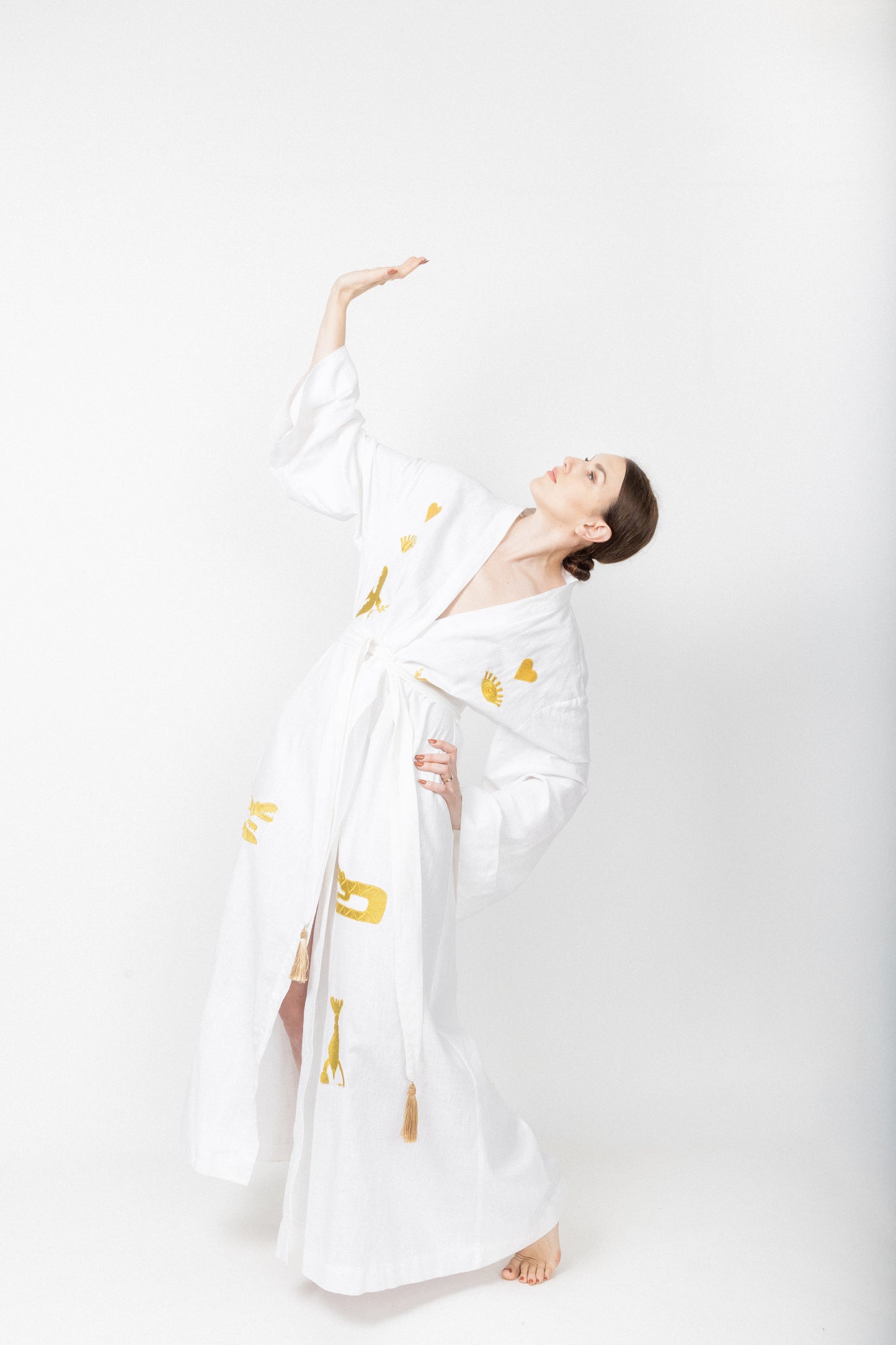 White embroidered gold wrap gown