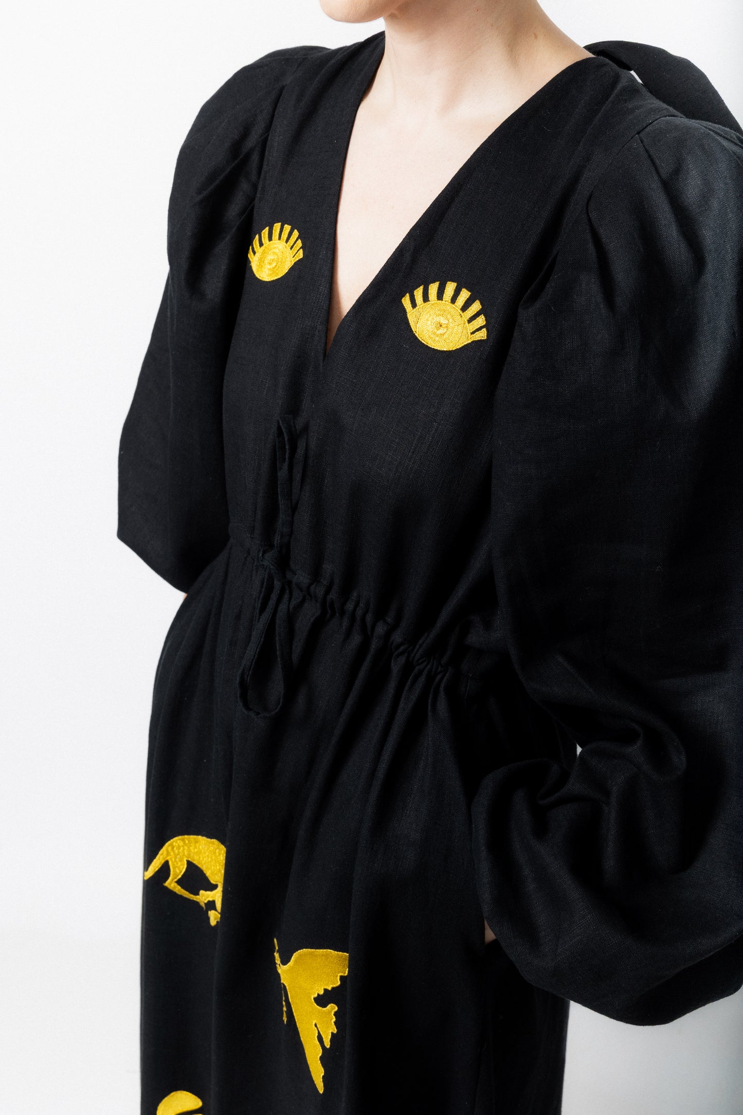 Black and gold embroidered v-neck dress
