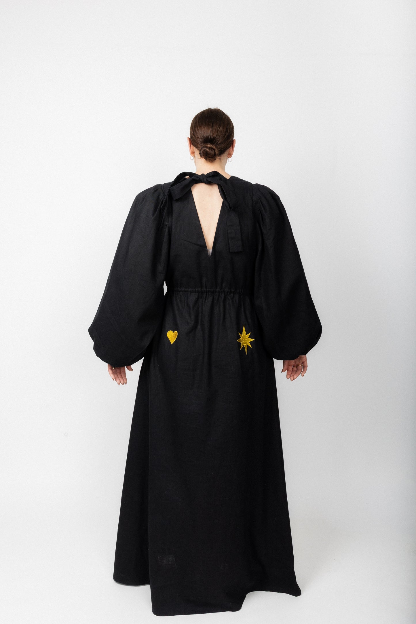 Black and gold embroidered v-neck dress