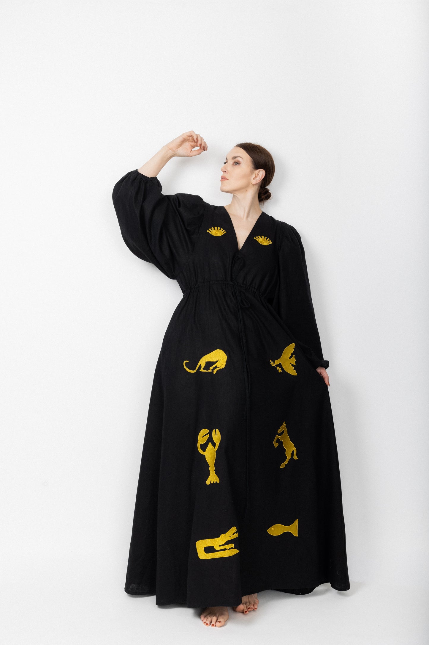 Black and gold embroidered v-neck dress