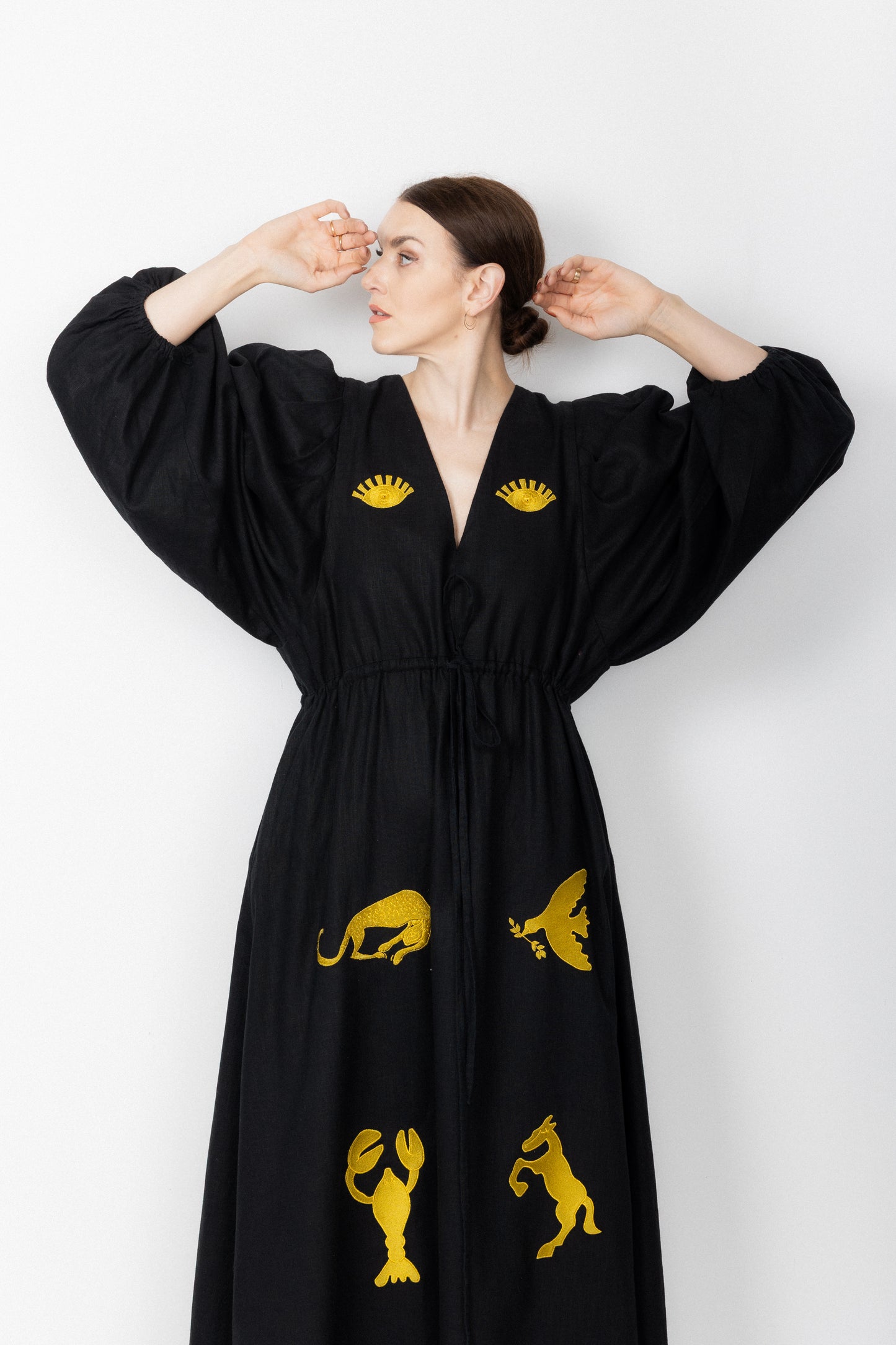 Black and gold embroidered v-neck dress
