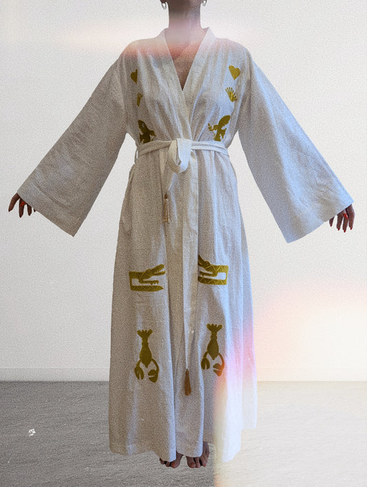 White embroidered gold wrap gown