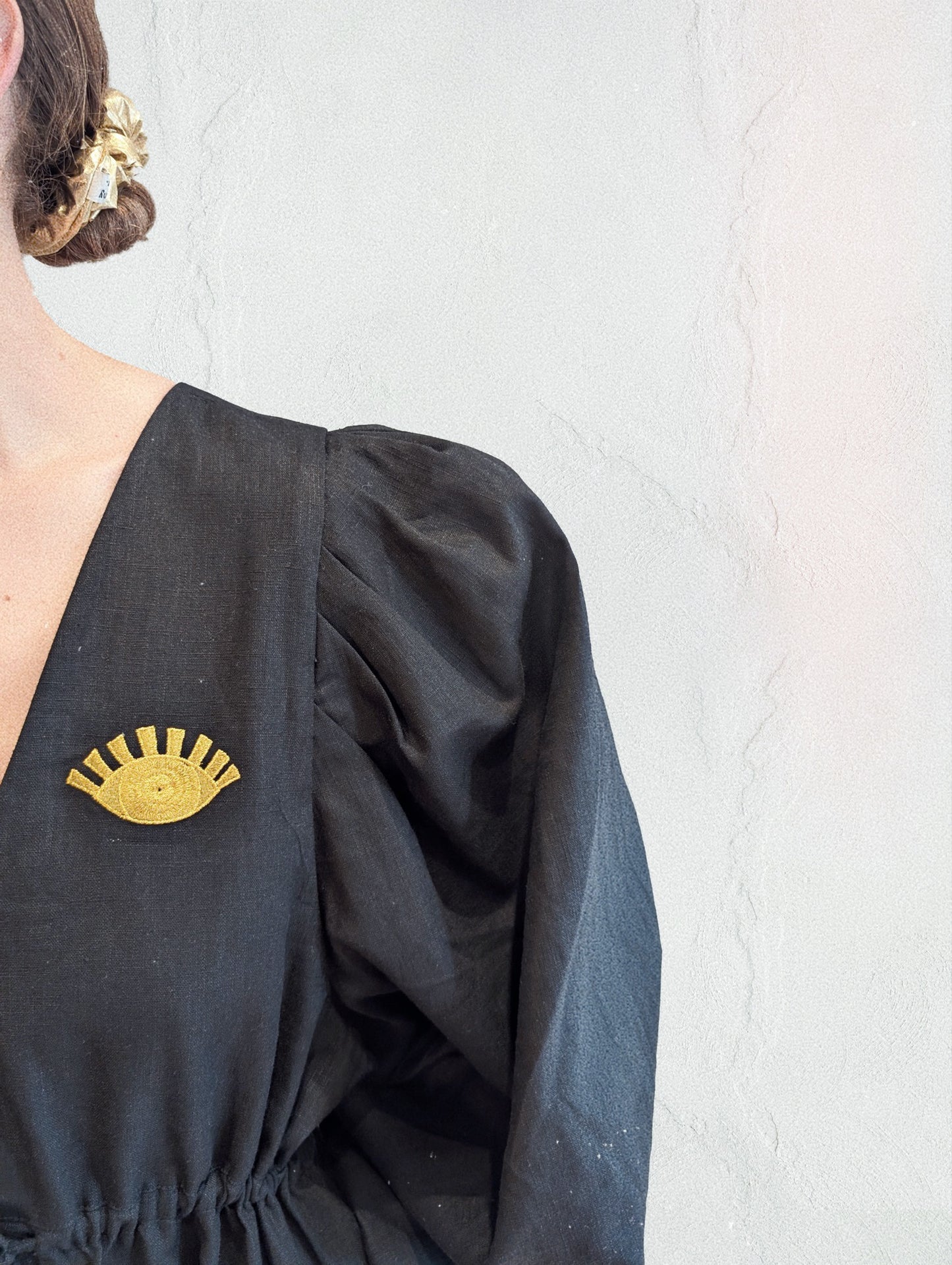 Black and gold embroidered v-neck dress